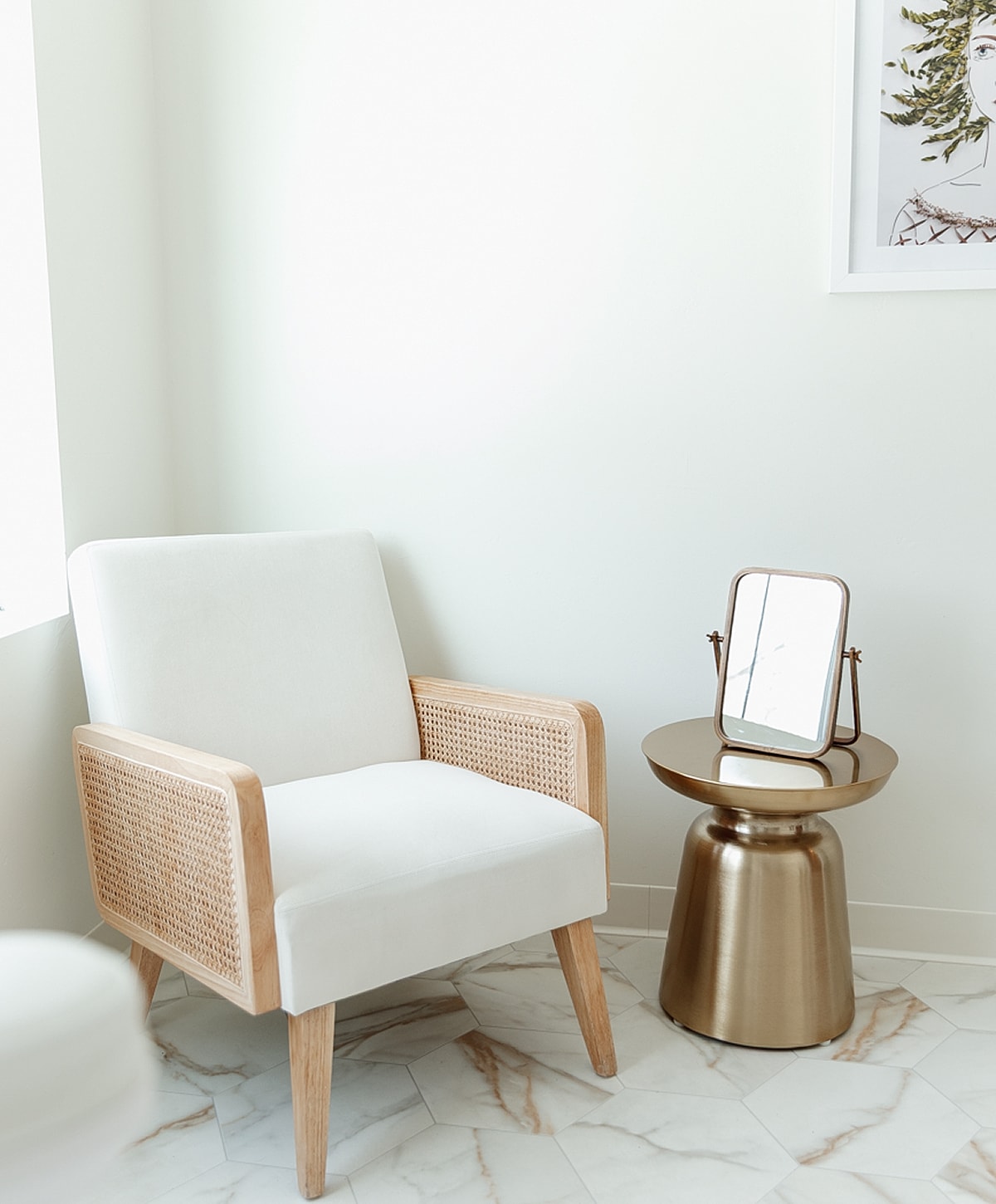 Cozy chair and mirror on stylish side table.