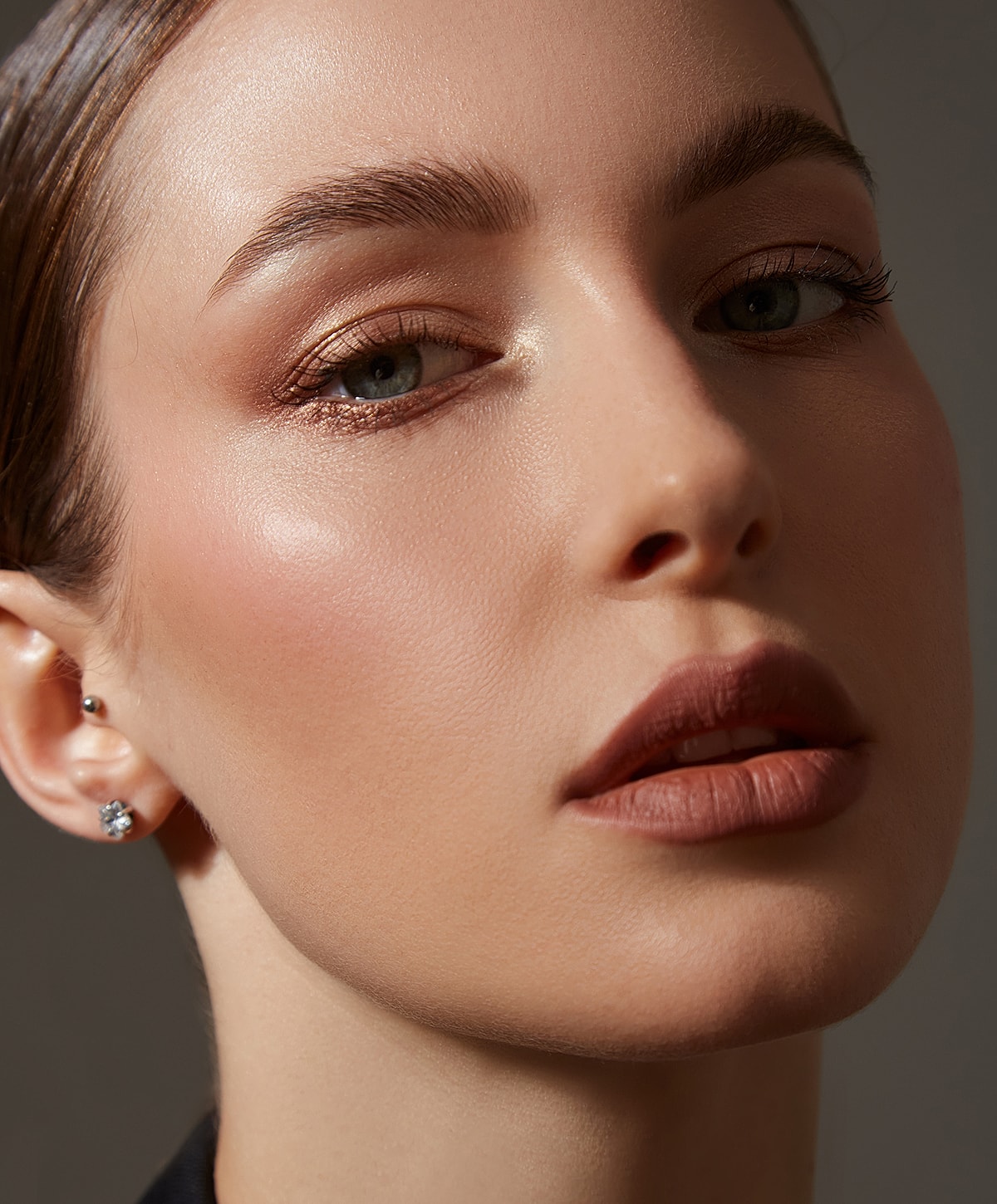 Close-up of a woman's face with makeup.